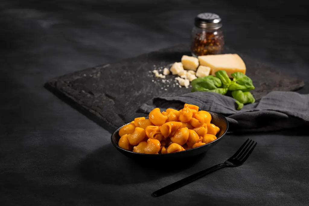 Lumaconi pasta in a dark bowl