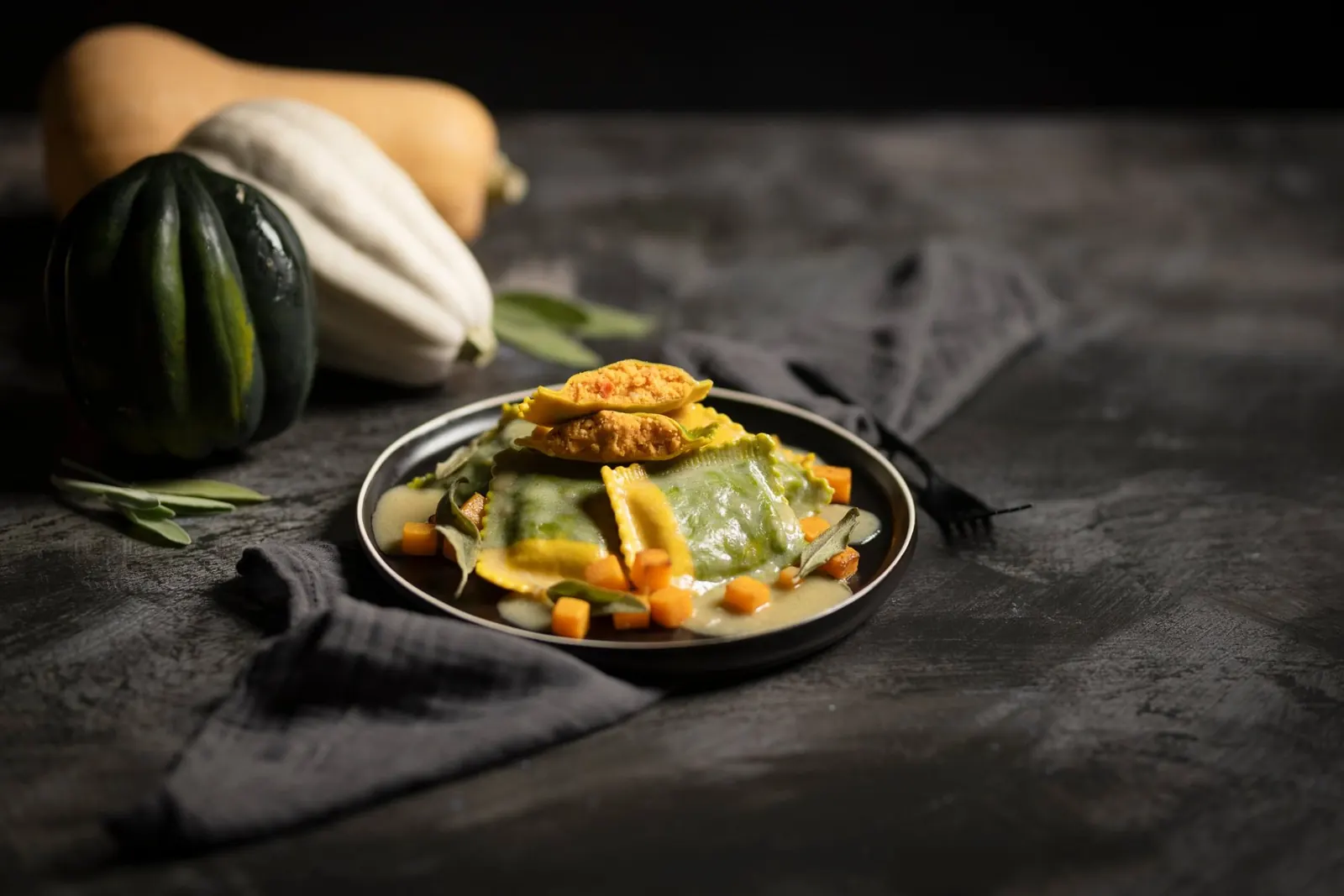 Roasted butternut squash ravioli cut open to show the filling